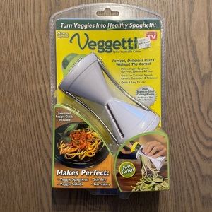 Veggetti. Never opened. Price tag still on. Turns veggies into “spaghetti”